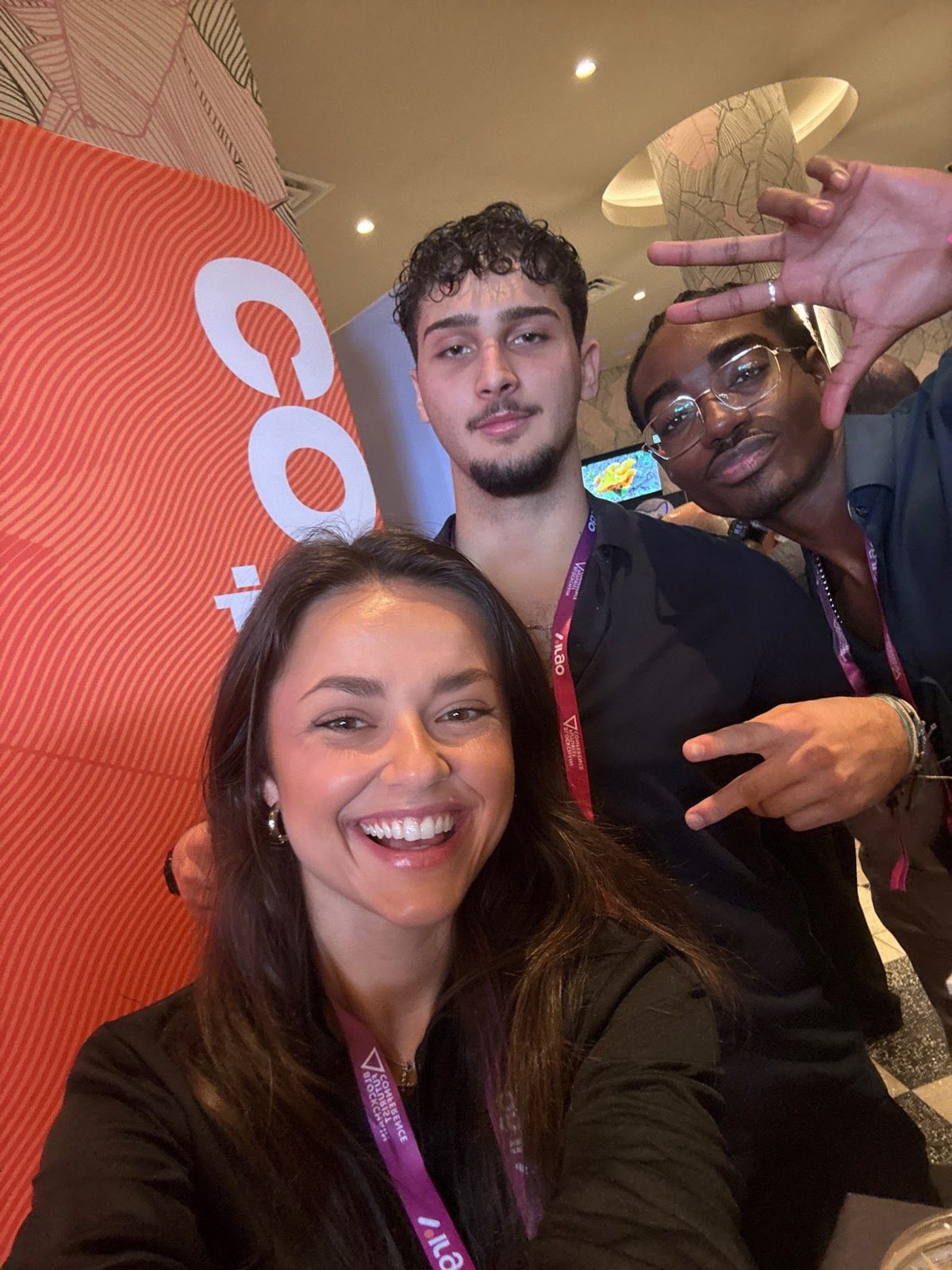 Coinbound team members taking a selfie at a crypto conference